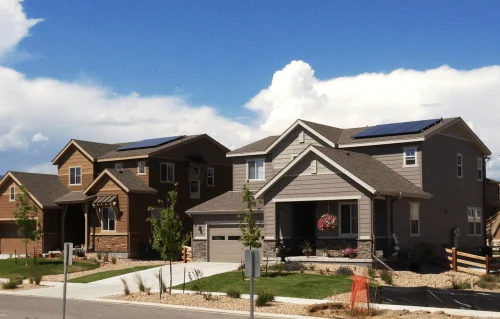 Two - two-story homes in Colorado Springs with small amount of solar panels on roof - best solar company in Colorado Springs