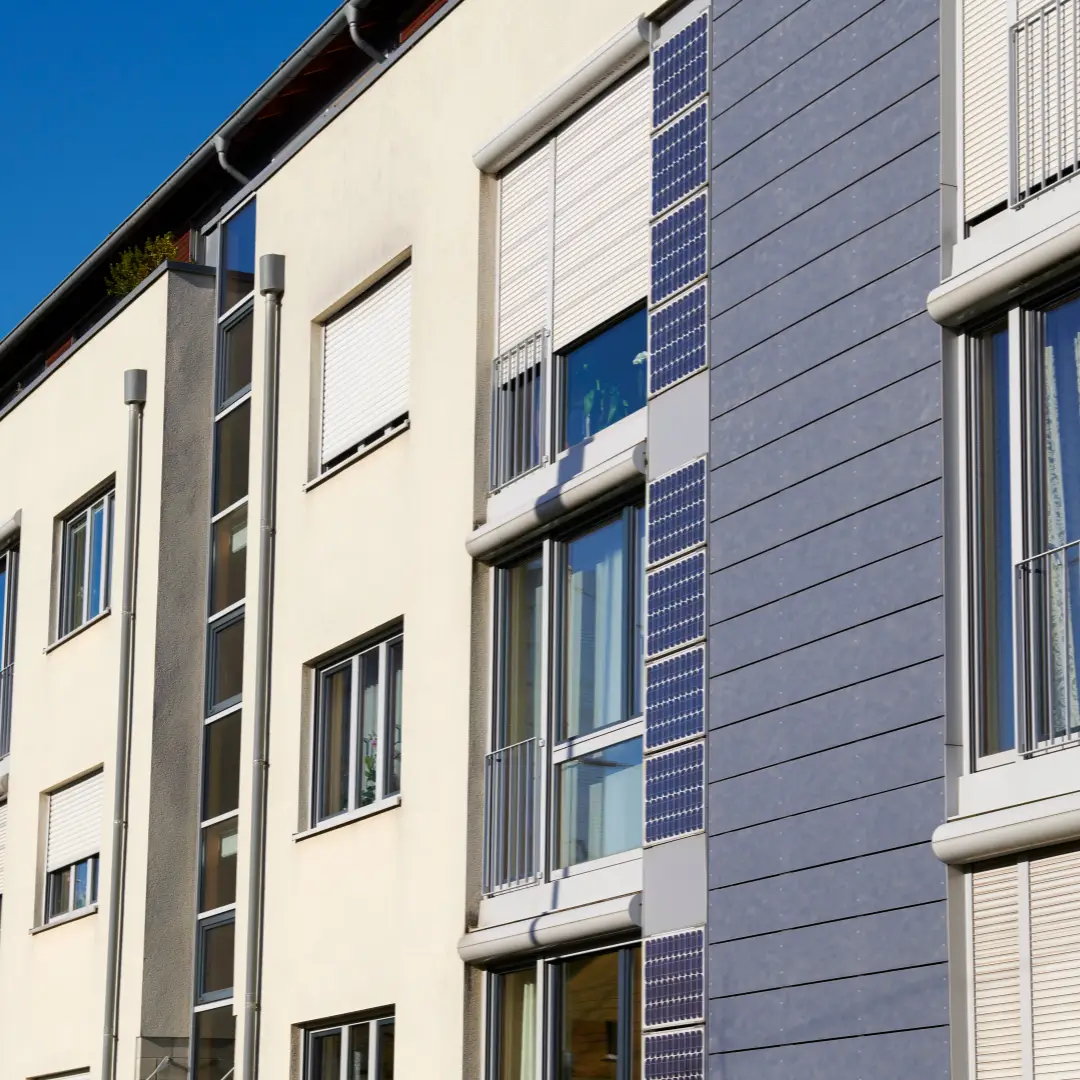 white town homes with solar panels on the side vertically.